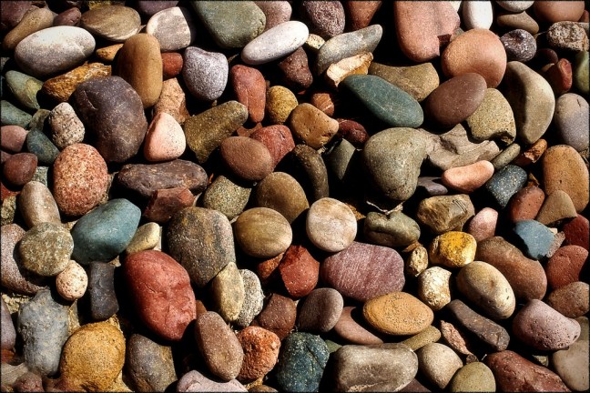 This photo shows a pile of stones in all different sizes and colors