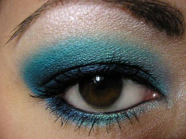 This photo shows a right eye with heavy blue eyeshadow and eyeliner